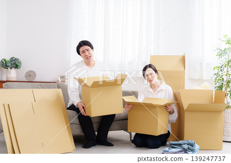A young couple preparing to move A young couple preparing to move 139247737