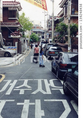 Korean Residential Street with Pedestrians and Vehicles 139248438