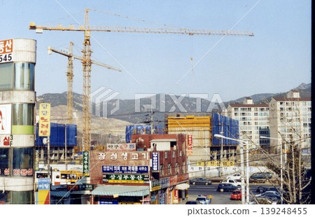 Urban Construction Site with Cranes and Buildings Urban Construction Site with Cranes and Buildings 139248455