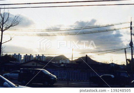 Urban Sunset with Power Lines and Buildings Urban Sunset with Power Lines and Buildings 139248505