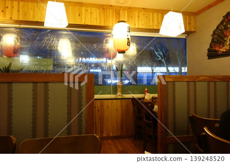 Cozy Restaurant Interior with Snowy Night View Cozy Restaurant Interior with Snowy Night View 139248520