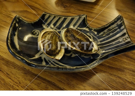 Grilled Oysters in Traditional Dish 139248529