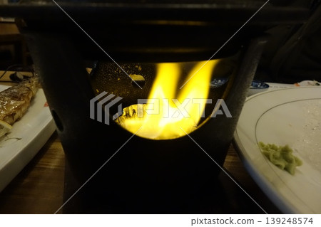 Flame in a Stove with Food Plates Flame in a Stove with Food Plates 139248574