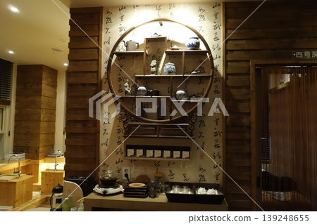Traditional Chinese Interior with Calligraphy Wall and Wooden Decor Traditional Chinese Interior with Calligraphy Wall and Wooden Decor 139248655