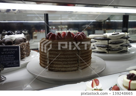 Bakery Display Case with Assorted Cakes 139248665