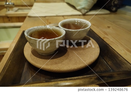 Two Ceramic Tea Cups on Wooden Tray Two Ceramic Tea Cups on Wooden Tray 139248676