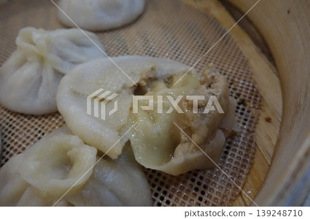 Steamed Buns with Visible Filling in Bamboo Steamer 139248710