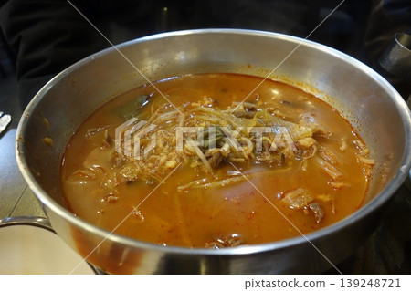 Steaming Korean Kimchi Stew in Metal Pot Steaming Korean Kimchi Stew in Metal Pot 139248721