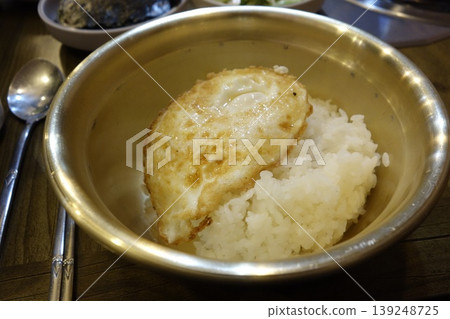 Fried Egg Over Rice in Metal Bowl Fried Egg Over Rice in Metal Bowl 139248725