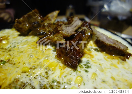 Grilled Ribs with Corn on a Plate Grilled Ribs with Corn on a Plate 139248824
