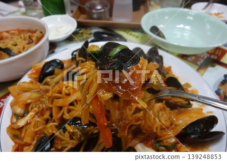 Spicy Mussels and Noodles Dish Close-up Spicy Mussels and Noodles Dish Close-up 139248853