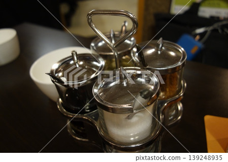 Metal Condiment Shakers on Table Metal Condiment Shakers on Table 139248935
