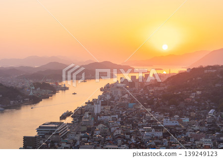 Winter in the Seto Inland Sea: Onomichi City, Hiroshima Prefecture - The town of Onomichi at dusk. 139249123