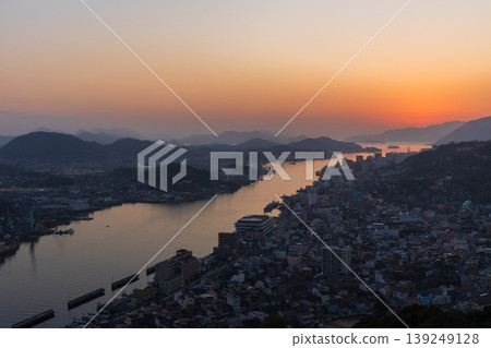 Winter in the Seto Inland Sea: Onomichi City, Hiroshima Prefecture - The town of Onomichi at dusk. Winter in the Seto Inland Sea: Onomichi City, Hiroshima Prefecture - The town of Onomichi at dusk. 139249128