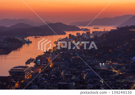Winter in the Seto Inland Sea: Onomichi City, Hiroshima Prefecture - The town of Onomichi at dusk. 139249130