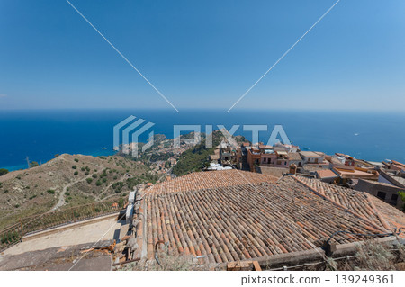 The cityscape of Taormina and the sea as seen from Castelmola, Italy. The cityscape of Taormina and the sea as seen from Castelmola, Italy. 139249361