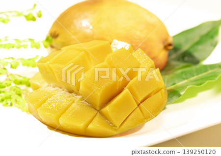 Cross-section of a cut mango Cross-section of a cut mango 139250120