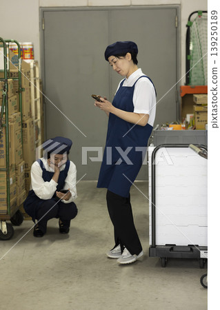 Staff taking a break in the back room Staff taking a break in the back room 139250189