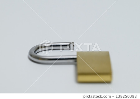 Close-up of an unlocked padlock Close-up of an unlocked padlock 139250388
