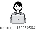 A young woman in a suit, smiling, working on her laptop; an office worker. 139250568