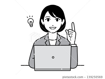 A young woman in a suit points to a computer screen while explaining a point; she is an office worker. A young woman in a suit points to a computer screen while explaining a point; she is an office worker. 139250569