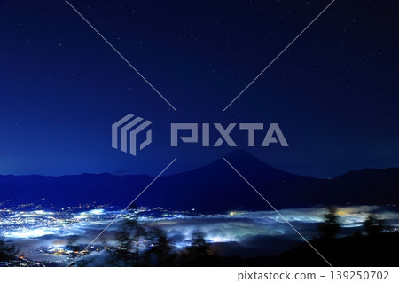 Mount Fuji and the night view of the Kofu Basin as seen from Mount Amari 139250702