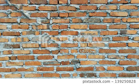 Traditional red brick wall texture with rough cement mix. Traditional red brick wall texture with rough cement mix. 139250828