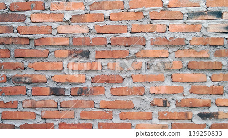 Traditional red brick wall texture with rough cement mix. Traditional red brick wall texture with rough cement mix. 139250833