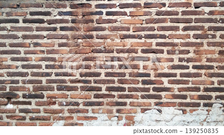Traditional red brick wall texture with rough cement mix. Traditional red brick wall texture with rough cement mix. 139250835