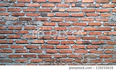Traditional red brick wall texture with rough cement mix. Traditional red brick wall texture with rough cement mix. 139250838