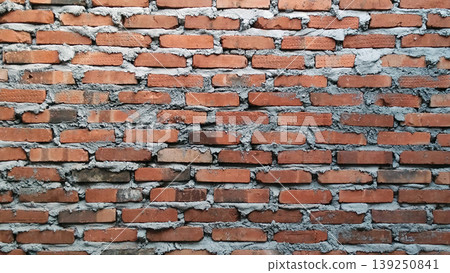 Traditional red brick wall texture with rough cement mix. Traditional red brick wall texture with rough cement mix. 139250841