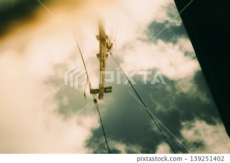 Utility poles reflected in the water Utility poles reflected in the water 139251402