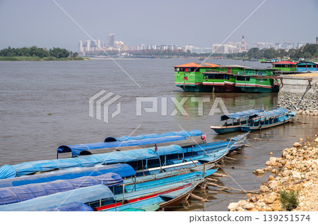 Local boat parking at the waterfront of Mekong river at Houayxay, Laos. The Mekong River is the longest river in Southeast Asia. Local boat parking at the waterfront of Mekong river at Houayxay, Laos. The Mekong River is the longest river in Southeast Asia. 139251574