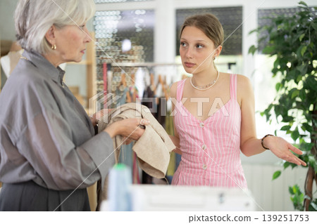 Mature dressmaker scolds assistant at work 139251753