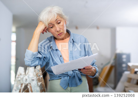 Elderly woman owner is shocked by the estimate for the renovation of cottage Elderly woman owner is shocked by the estimate for the renovation of cottage 139252008