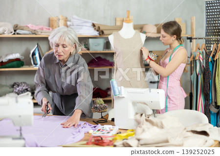 Woman Tailor Cuts Material Woman Tailor Cuts Material 139252025