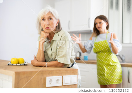 Offended old woman quarreling with her daughter at home Offended old woman quarreling with her daughter at home 139252122