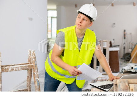 Young man working in construction site Young man working in construction site 139252126
