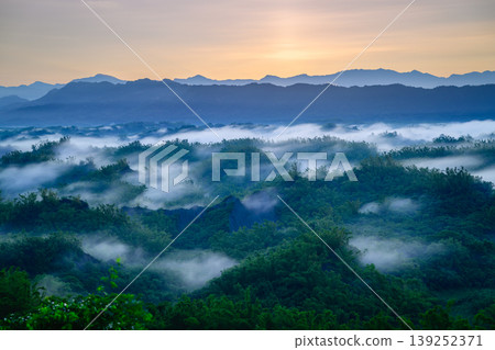Sunrise over the misty mountains in Zuozhen, Tainan, Taiwan Sunrise over the misty mountains in Zuozhen, Tainan, Taiwan 139252371
