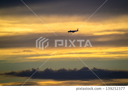 Airplane Flying Over Tamsui Bridge at Sunset in New Taipei City Airplane Flying Over Tamsui Bridge at Sunset in New Taipei City 139252377