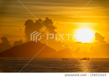 Sunrise over Guishan Island in Zhuangwei, Yilan, Taiwan Sunrise over Guishan Island in Zhuangwei, Yilan, Taiwan 139252423