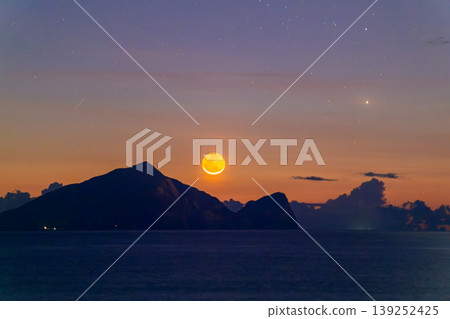 Crescent Moon Rising Over Guishan Island in Yilan Taiwan Crescent Moon Rising Over Guishan Island in Yilan Taiwan 139252425