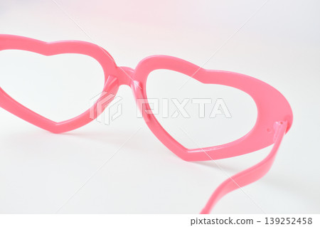 pink heart shape of glasses on white background 139252458