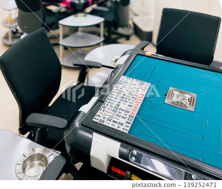 A beautiful mahjong parlor with the latest mahjong tables. 139252471