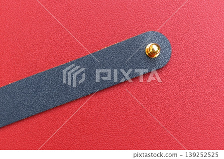 shiny red leather background with dark blue strap shiny red leather background with dark blue strap 139252525