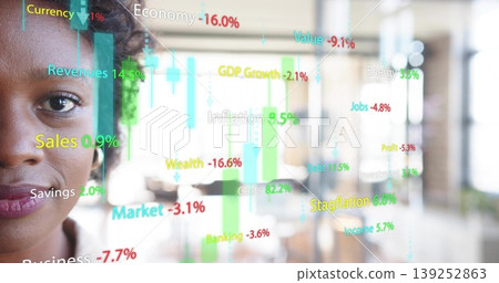 Studying businesswoman reviewing colorful financial overlay in open-plan office, copy space 139252863