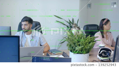 Typing coworker with laptop and colleague holding coffee cup gazing right in office with VR headset Typing coworker with laptop and colleague holding coffee cup gazing right in office with VR headset 139252943