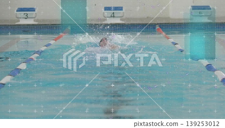 Male swimmer gliding through pool lane, with swim cap, lane dividers, starting blocks 3 4 5 Male swimmer gliding through pool lane, with swim cap, lane dividers, starting blocks 3 4 5 139253012