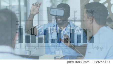 Gesturing doctor wearing VR headset, stethoscope at hospital training room, displaying data overlay Gesturing doctor wearing VR headset, stethoscope at hospital training room, displaying data overlay 139253184