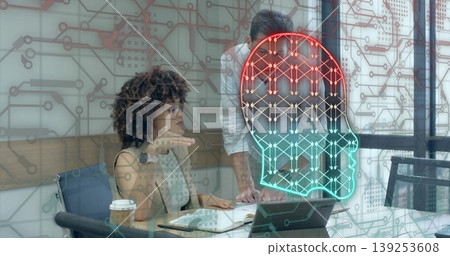 Tech professionals reviewing tablet and notebook in conference room, with circuit AI head overlay Tech professionals reviewing tablet and notebook in conference room, with circuit AI head overlay 139253608
